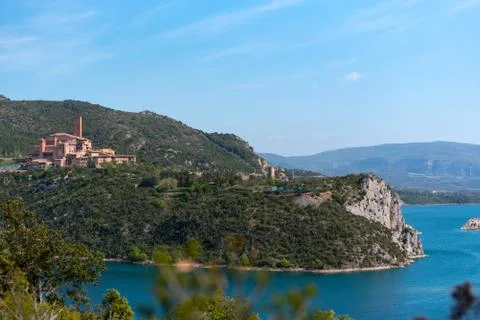 View of the Shrine of Torreciudad from El Grado dam, Aragon, Spain. Stock Photos