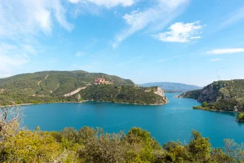 View of the Shrine of Torreciudad from El Grado dam, Aragon, Spain. Stock Photos