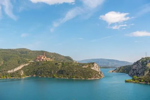 View of the Shrine of Torreciudad from El Grado dam, Aragon, Spain. Stock Photos