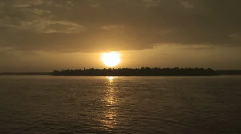 View of Shroeline from A Boat On the Amazon River At Sunset 動画素材 19045742