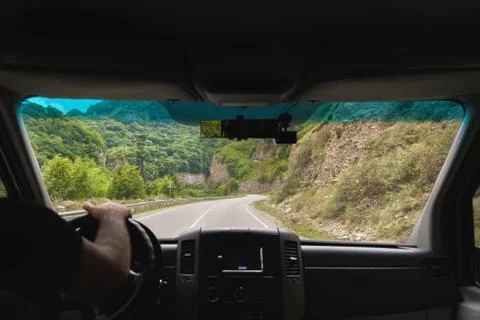 View from the shuttle bus to the mountain road Stock Photos