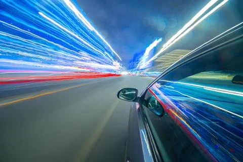 View from Side of Car moving in a night city Stock Photos