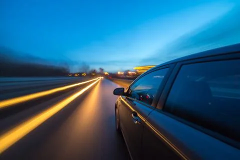View from Side of Car moving in a night city Stock Photos