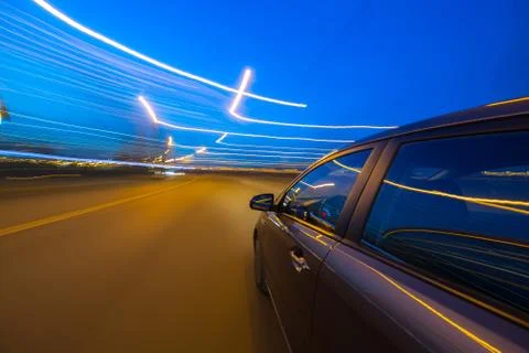 View from Side of Car moving in a night city Stock Photos