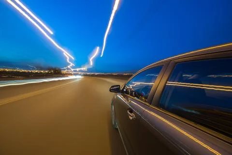 View from Side of Car moving in a night city Stock Photos