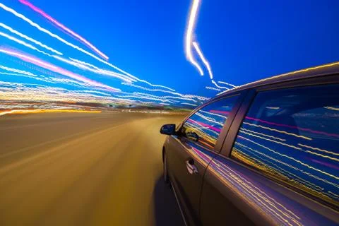 View from Side of Car moving in a night city Stock Photos