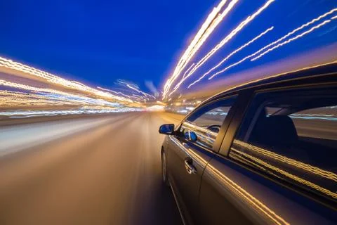 View from Side of Car moving in a night city Stock Photos