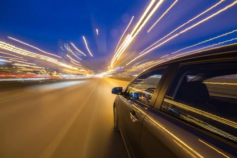 View from Side of Car moving in a night city Stock Photos
