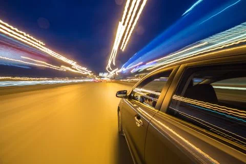 View from Side of Car moving in a night city Stock Photos