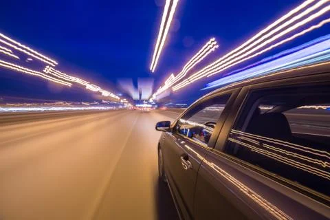 View from Side of Car moving in a night city Stock Photos