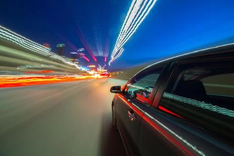 View from Side of Car moving in a night city Stock Photos