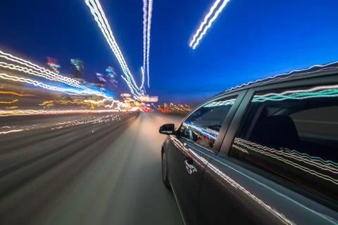 View from Side of Car moving in a night city Stock Photos