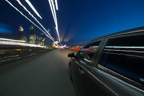 View from Side of Car moving in a night city Stock Photos
