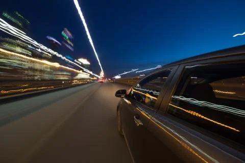 View from Side of Car moving in a night city Stock Photos