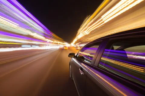 View from Side of Car moving in a night city Stock Photos