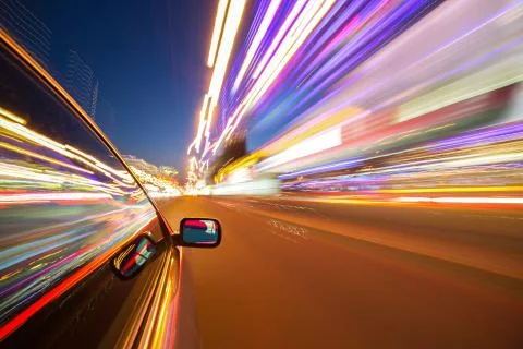 View from Side of Car moving in a night city Stock Photos