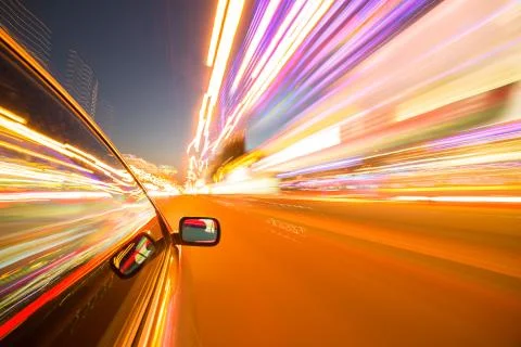 View from Side of Car moving in a night city Stock Photos