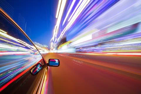 View from Side of Car moving in a night city Stock Photos