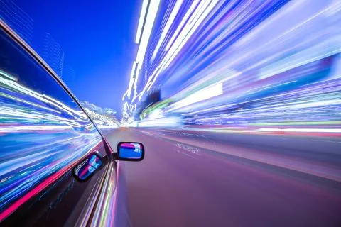 View from Side of Car moving in a night city Stock Photos
