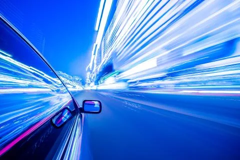 View from Side of Car moving in a night city Stock Photos