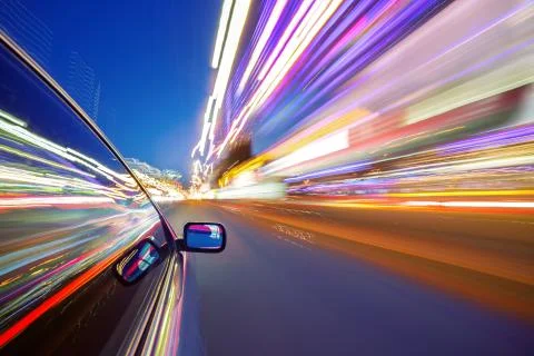 View from Side of Car moving in a night city Stock Photos