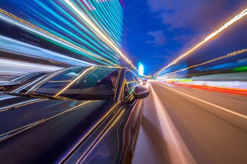 View from Side of Car moving in a night city Stock Photos