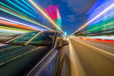 View from Side of Car moving in a night city Stock Photos