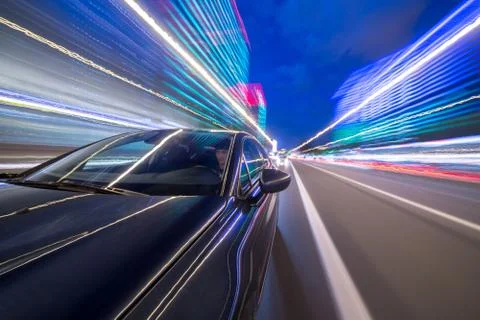 View from Side of Car moving in a night city Stock Photos