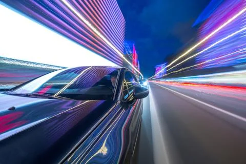 View from Side of Car moving in a night city Stock Photos