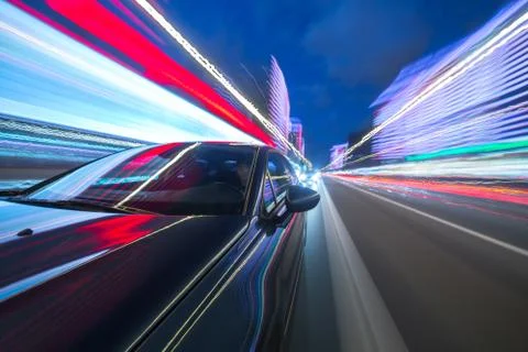 View from Side of Car moving in a night city Stock Photos