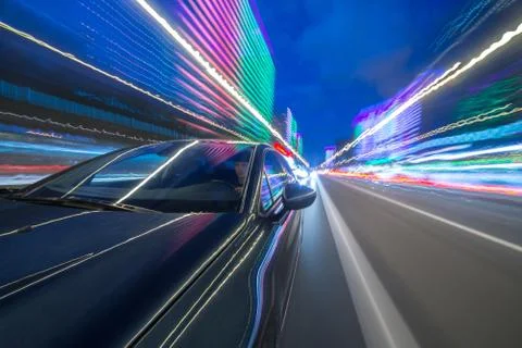View from Side of Car moving in a night city Stock Photos