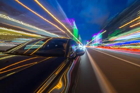 View from Side of Car moving in a night city Stock Photos