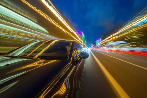 View from Side of Car moving in a night city Stock Photos