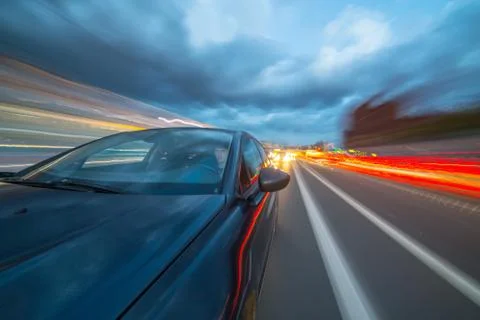View from Side of Car moving in a night city Stock Photos