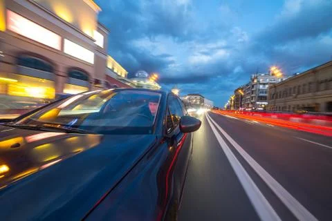View from Side of Car moving in a night city Stock Photos