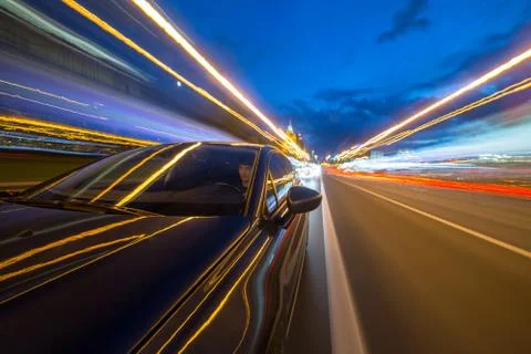 View from Side of Car moving in a night city Stock Photos