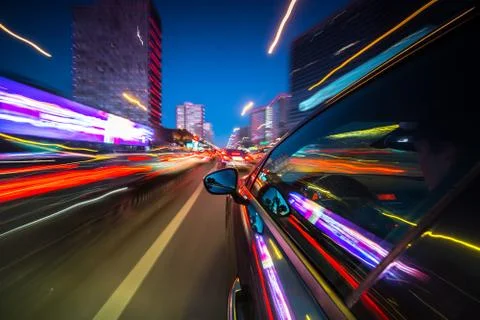 View from Side of Car moving in a night city Stock Photos