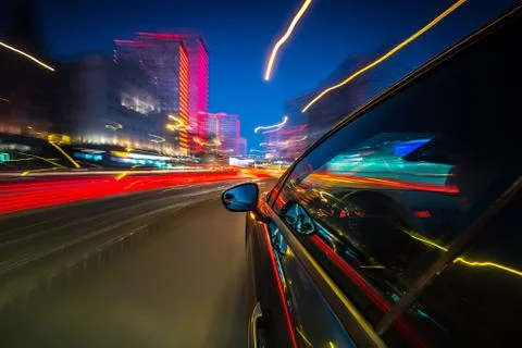 View from Side of Car moving in a night city Stock Photos