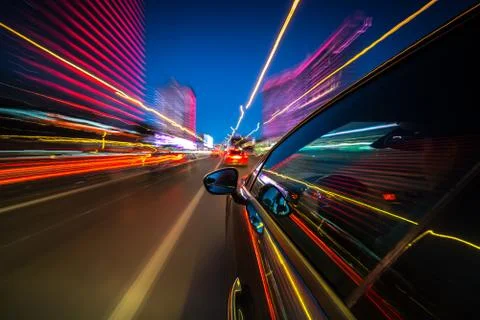 View from Side of Car moving in a night city Stock Photos