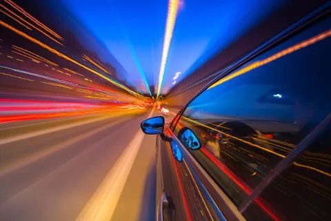 View from Side of Car moving in a night city Stock Photos