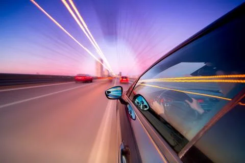 View from Side of Car moving in a night city Stock Photos
