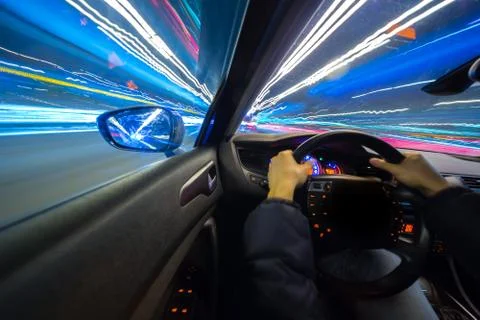 View from Side of Car moving in a night city Stock Photos