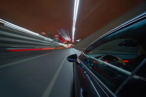 View from Side of Car moving in a night city Stock Photos