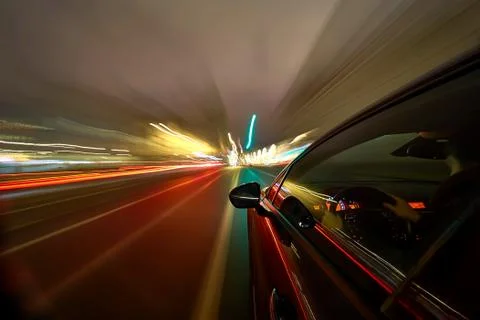 View from Side of Car moving in a night city Stock Photos