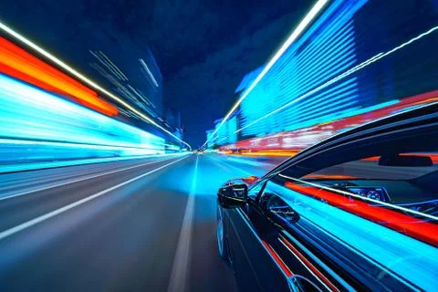 View from Side of Car moving in a night city Stock Photos