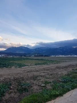 View from the side of the city in front of mountain Stock-Fotos