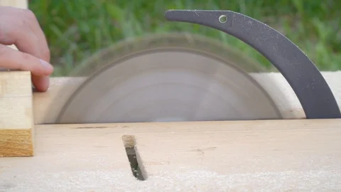 View side close-up man cuts off a wooden board Stock Footage 109067260