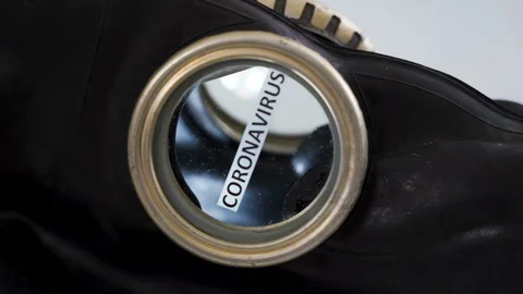 View of the side of the hazard mask with the coronavirus or Covid-19 Stock Footage 129451282