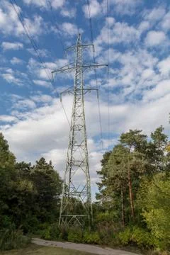 View side of high voltage pole in blue sky Foto stock
