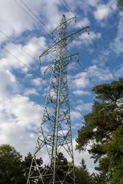 View side of high voltage pole in blue sky Stock Photos